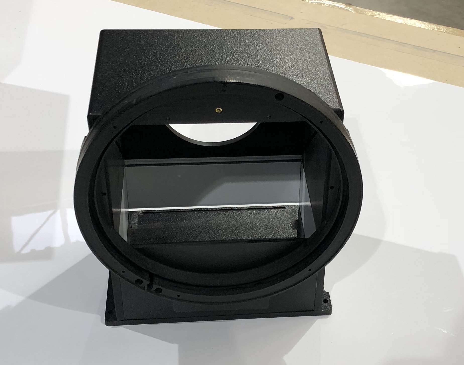 Black Camera case with large circular front and plastic insert